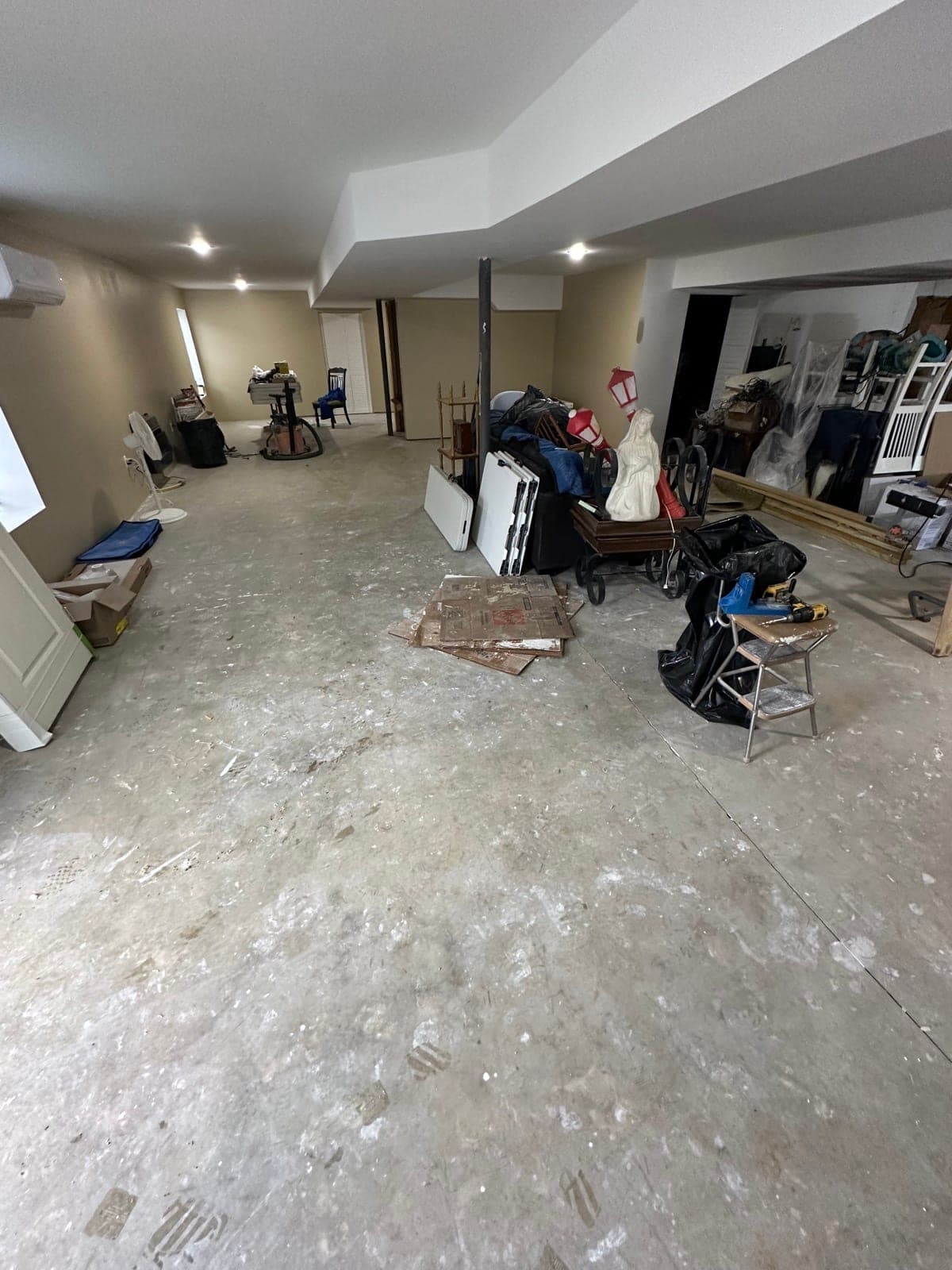 Couches, toys, and miscellaneous clutter cleared from a finished basement in York County