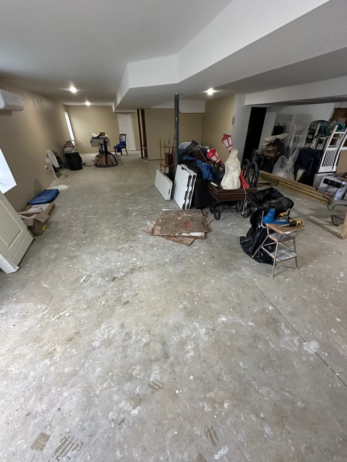 Couches, toys, and miscellaneous clutter cleared from a finished basement in York County