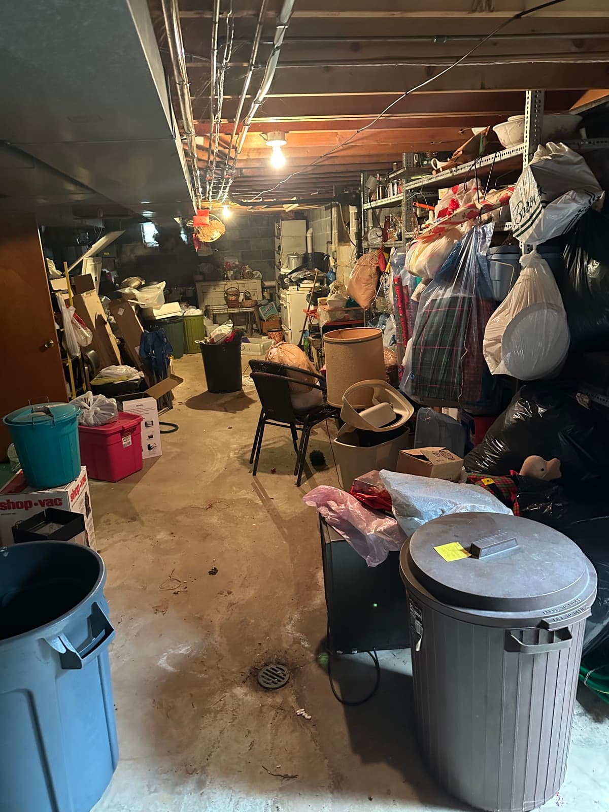 Holiday décor and boxed household goods staged for haul-out during a basement cleanout — The Junk Lord, York County