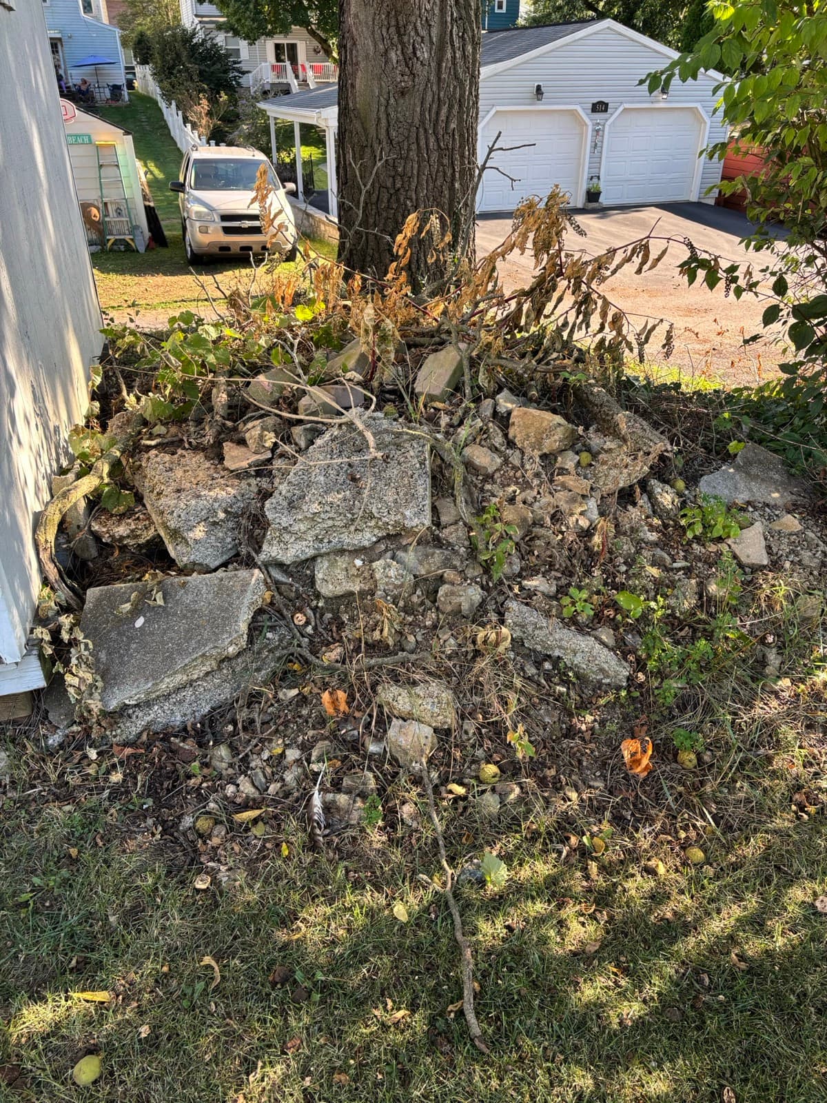 Concrete and stone rubble piled in a yard for removal — The Junk Lord