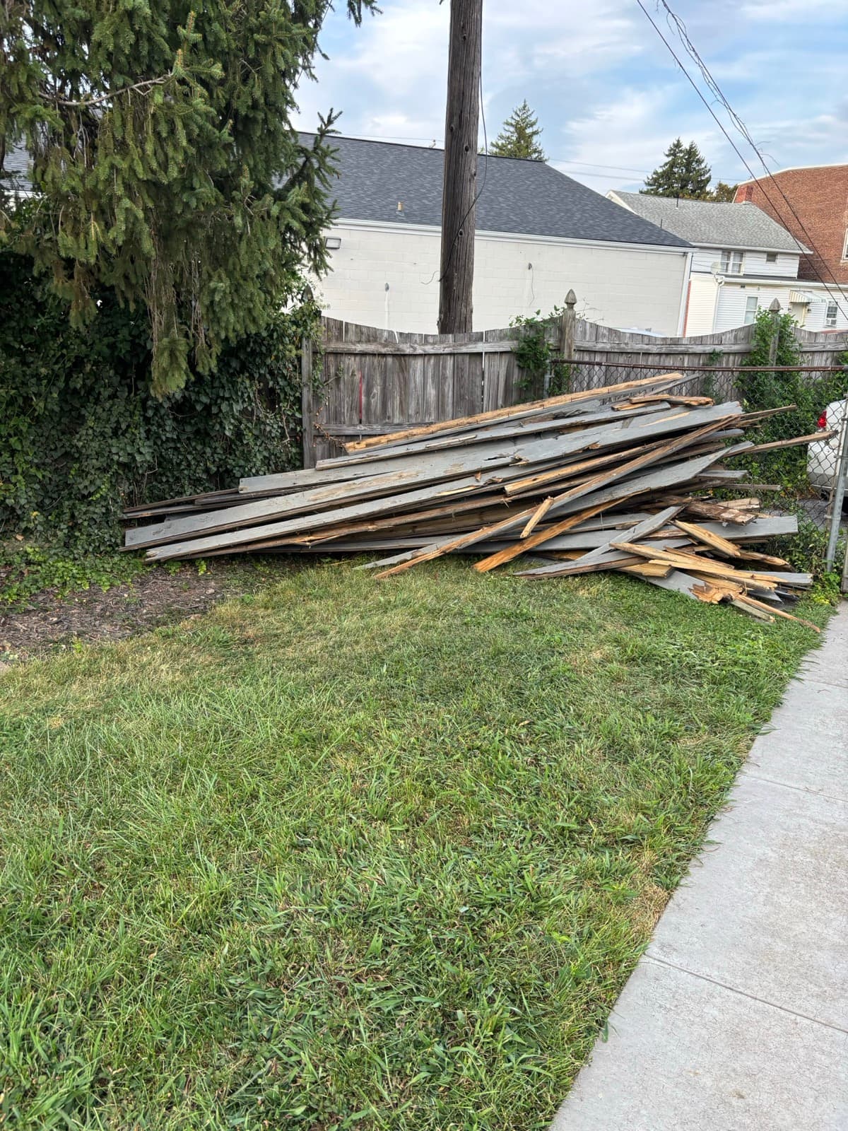Stacked lumber from a remodel staged for haul-away in York County, PA — The Junk Lord