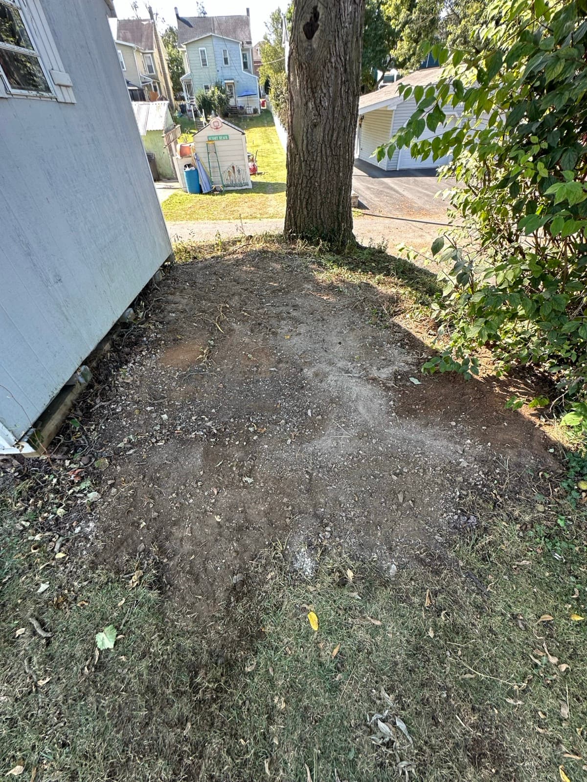 Cleared yard and gravel patch after a construction debris removal — The Junk Lord