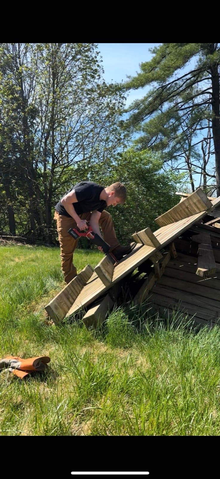 William dismantling a backyard playset with a power tool in York County, PA — The Junk Lord