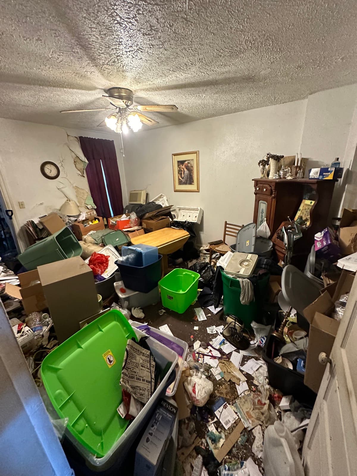 Hoarder kitchen in York County, PA filled floor-to-ceiling with trash bags, totes, and household debris — Junk Lord pre-cleanout walkthrough