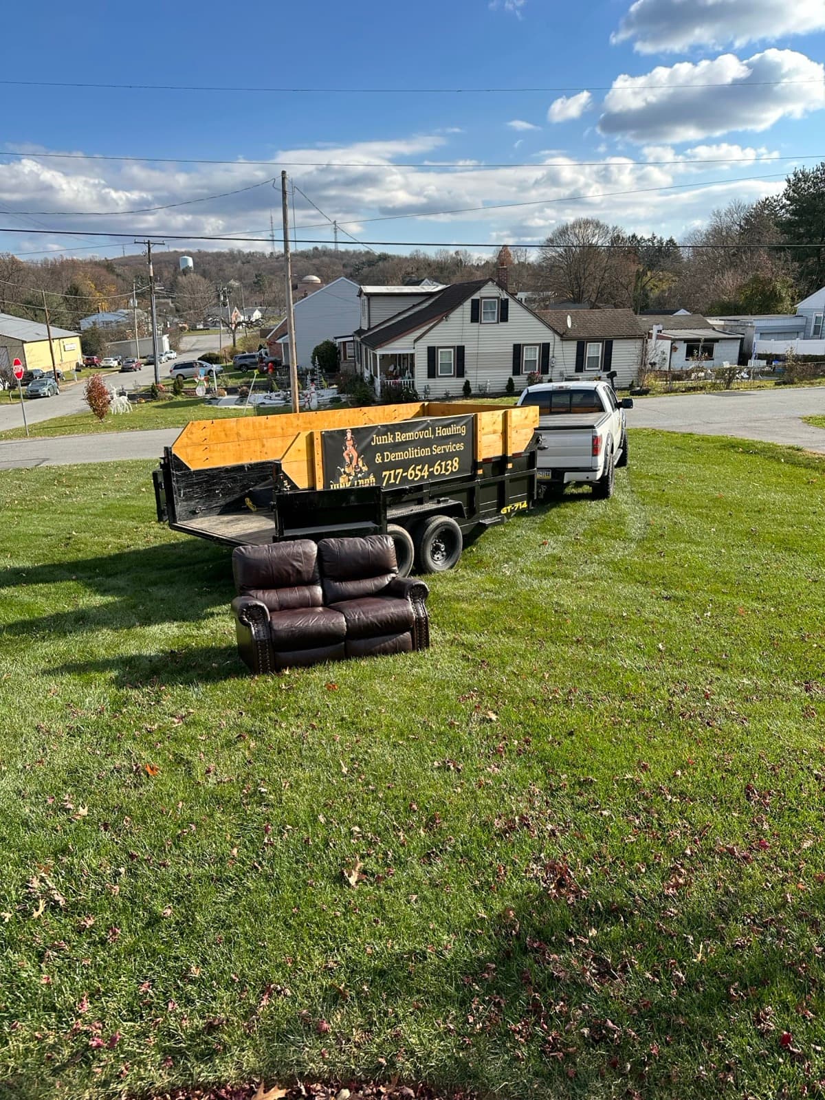 Rolled carpets and rugs loaded onto the Junk Lord branded trailer in York County, PA