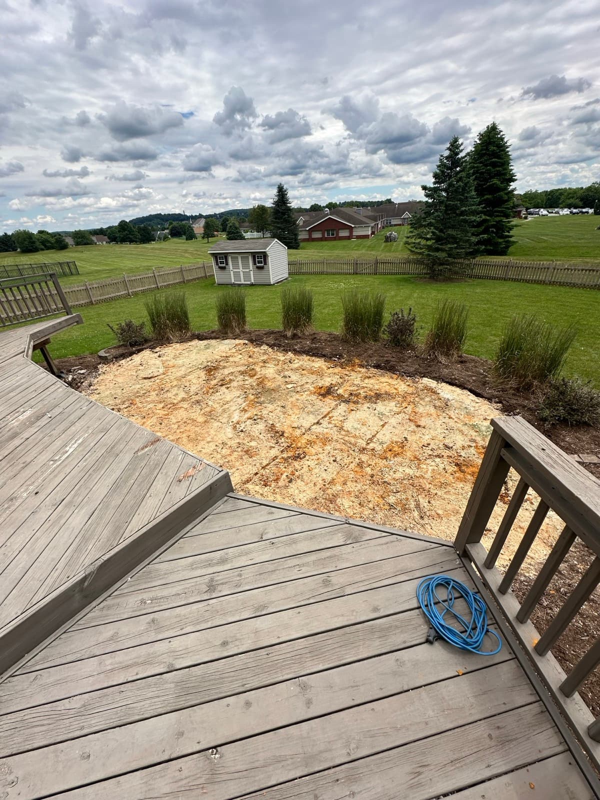 Empty wooden deck and yard patch where a hot tub once sat — Junk Lord finished job in York County, PA
