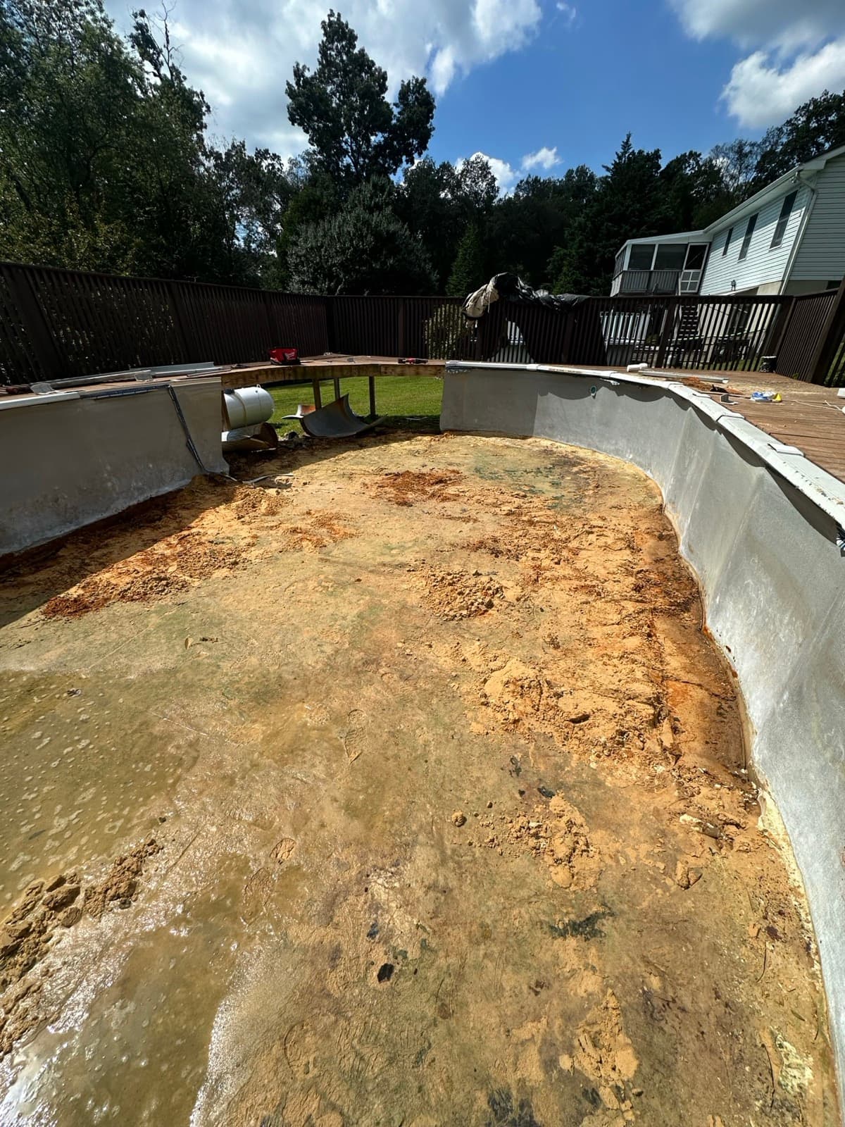Cleared pool footprint next to a deck in York County, PA after The Junk Lord finished a removal