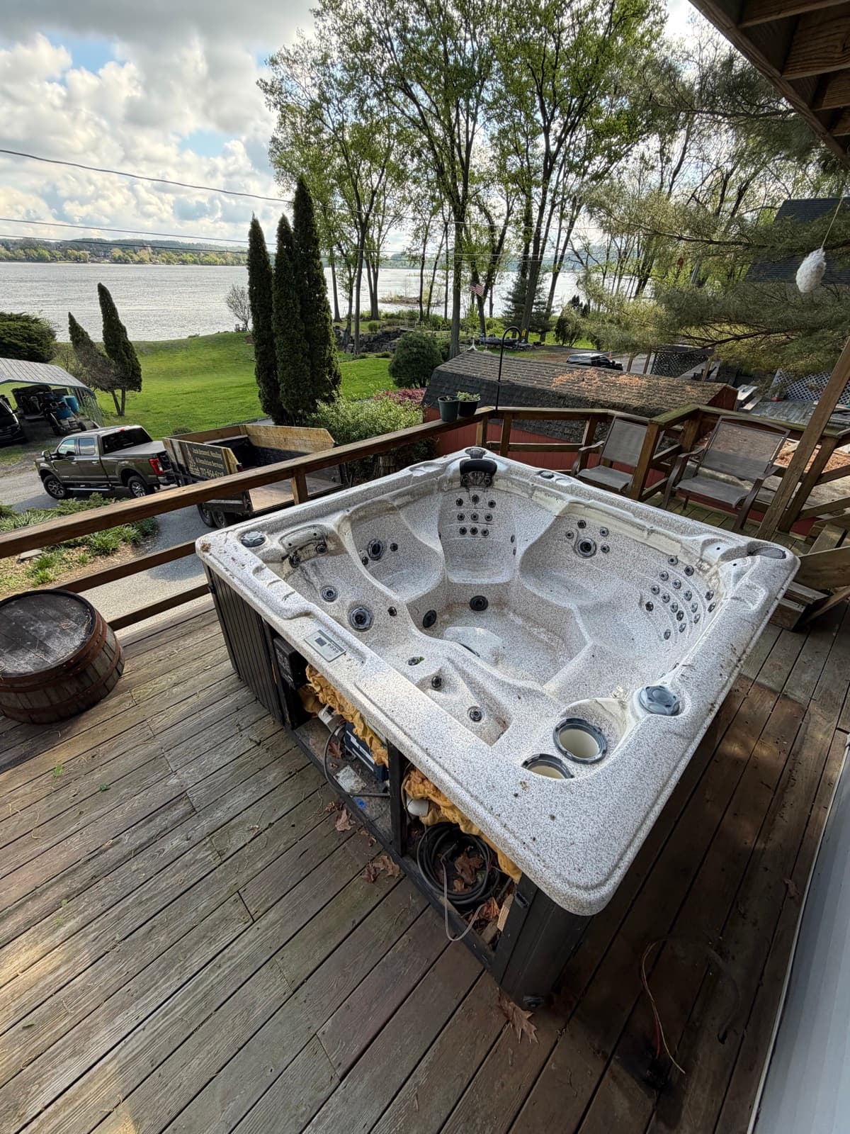 Hot tub interior exposed during dismantling on a residential backyard deck — The Junk Lord, York County