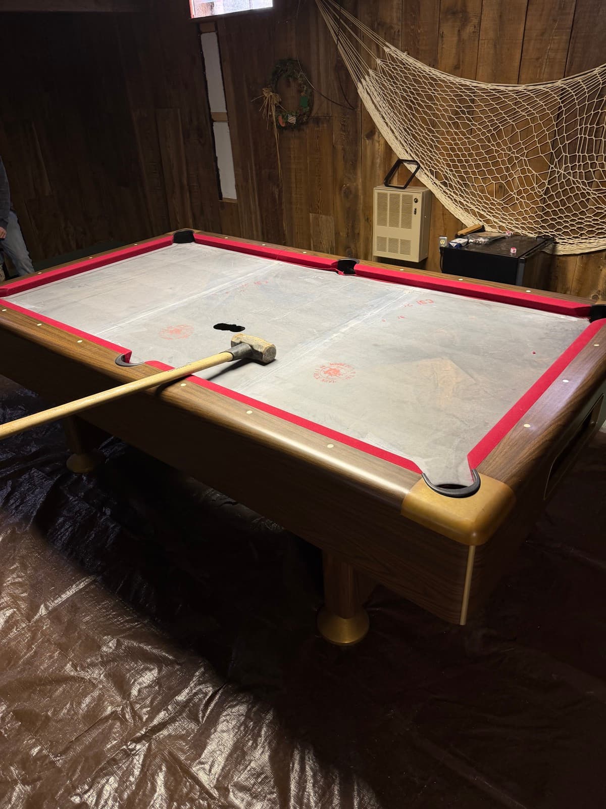 Felt stripped and slate top exposed during a pool table teardown — The Junk Lord, York County