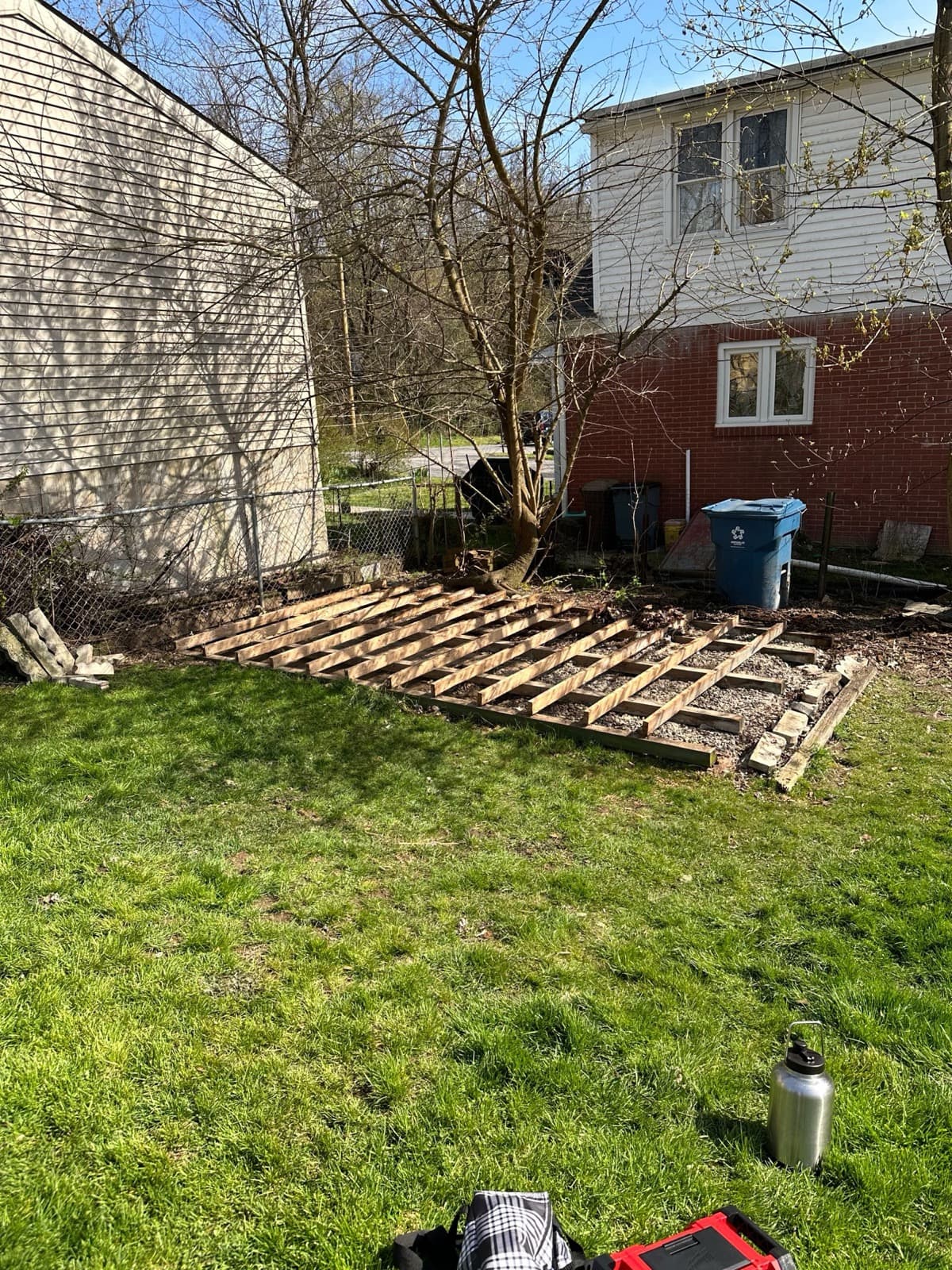 Bare shed floor joists left on a gravel pad after the structure came down — The Junk Lord, York County PA