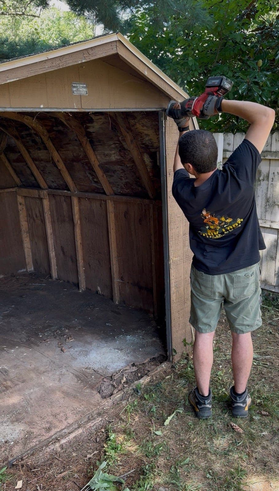 William removing shed siding with a power tool in York County, PA — The Junk Lord