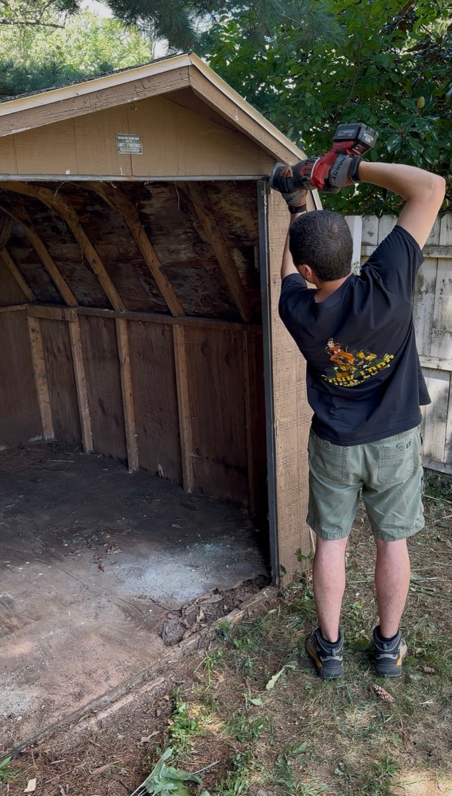 William removing shed siding with a power tool in York County, PA — The Junk Lord
